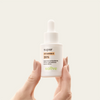 Super Vitamina C 20% Sallve 30ml na mão – frasco com conta-gotas